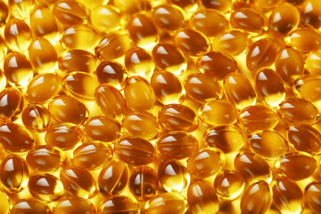 Golden Vitamin D3 Capsules close-up in full screen