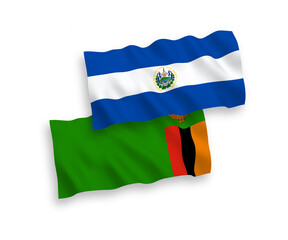 National vector fabric wave flags of Republic of Zambia and Republic of El Salvador isolated on white background. 1 to 2 proportion.