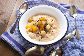 rice pudding with fruit cocktail and chocolate sprinkles