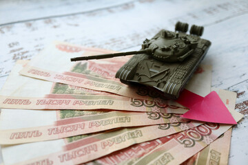 toy tank on the russian banknotes 5000 roubles crisis risk sanctions war conflict russia ukraine...