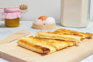 Delicious and sweet puff pastry sticks with cinnamon