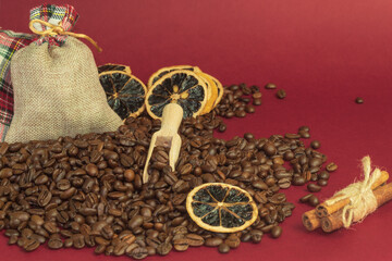 Heap of coffee beans and cinnamon sticks