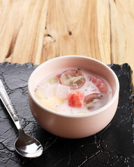 Sop Buah or Es Buah is Mixed Fruit with Coconut or Simple Syrup, Served with Shaved Ice and add Condensed Milk to Add Creamy Swetened, Popular for Buka Puasa (Breakfasting).