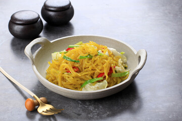 Mie Glosor or Mie Gelosor. Glossy Yellow Noodles popular in Bogor, West Java. Noodles Made from Tapioca or Sagoo Flour (Aci) mixed with Turmeric