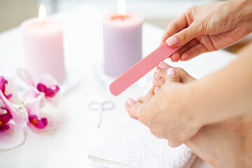 Woman Doing Pedicure Caring For Fingernails At Home
