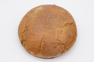 Loaf of rye bread on white background