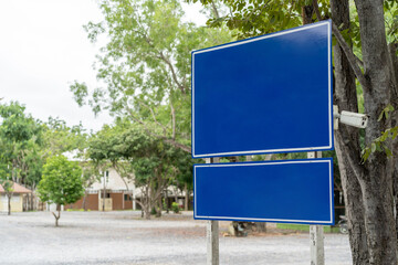 Blue traffic sign in paking lots with tree around. Clipping Paths