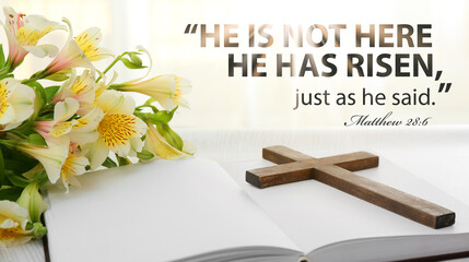 Holy Bible with cross and flowers on light background