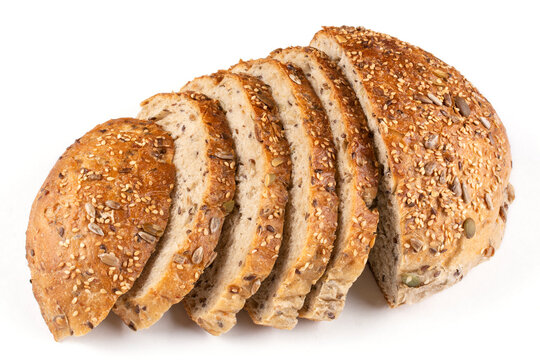 Round bread made of whole wheat flour with pumpkin, sesame, flax and sunflower seeds cut into pieces on a white isolated background. Bread without yeast, with sourdough. Proper nutrition.