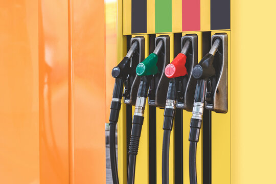 Petrol station with colored guns and fuel hoses. Gasoline, diesel, eco hydrogen refueling column.. Close-up.