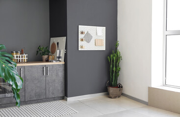 Interior of contemporary kitchen with modern furniture and pegboard