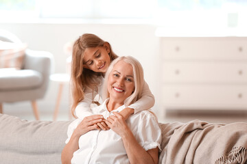 Little girl with her grandma at home