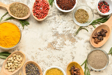 Frame made of different spices and herbs on grunge background, closeup