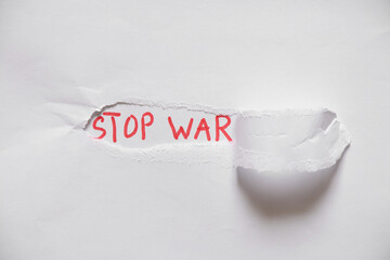Written text stop war on white paper, protest action, no war between Russia and Ukraine. Stop war,...
