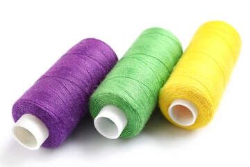 Beautiful sewing threads on white background