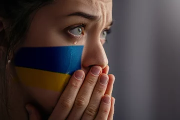 Papier Peint Lavable Kiev Crying sad feared depressed frightened emotional woman with Ukraine flag on face in the dark. Stop war between Russia and Ukraine. Pray and hope for peace and world. Copy space
