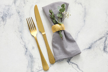 Stylish simple table setting and flowers on light background