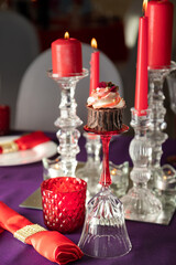 Pink and purple decoration and cupcakes on the table