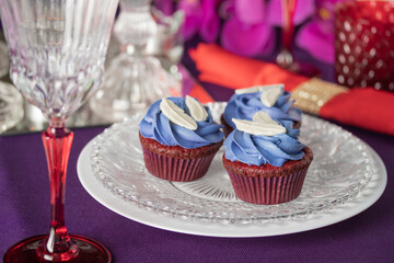 Pink and purple decoration and cupcakes on the table