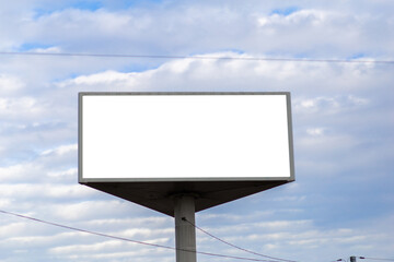 White screen billboard mockup against sky with clouds