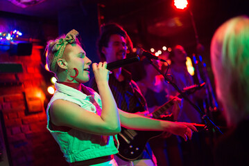 Rock group playing on the night concert in the club