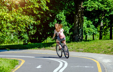 Fototapeta premium Cyclist ride on the bike path in the city Park 