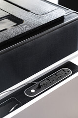 Mobile phone with wireless charger on table. Modern workplace accessory