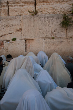 Jewish priests known as Cohanim cover their heads with prayer shawls in the prayer section beside the Western Wall in Jerusalem for the blessing for the Jewish people on Passover and Sukkot. 