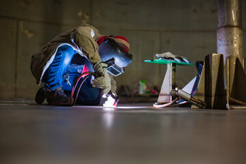 Welding  arc argon worker male repaired metal is welding sparks industrial construction tank...