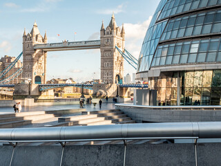 Tower Bridge and City Hall. London. Famous landmarks captured from within the contemporary More London district on the south of the River Thames. - 490543248