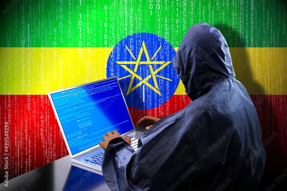 Poster anonymous hooded hacker, flag of ethiopia, binary code - cyber attack concept