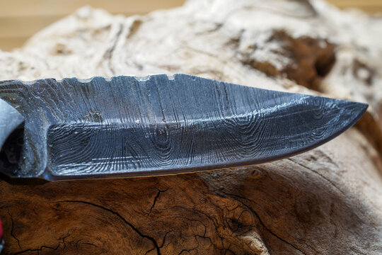 knife made of several layers of steel with an exclusive pattern photographed in the studio