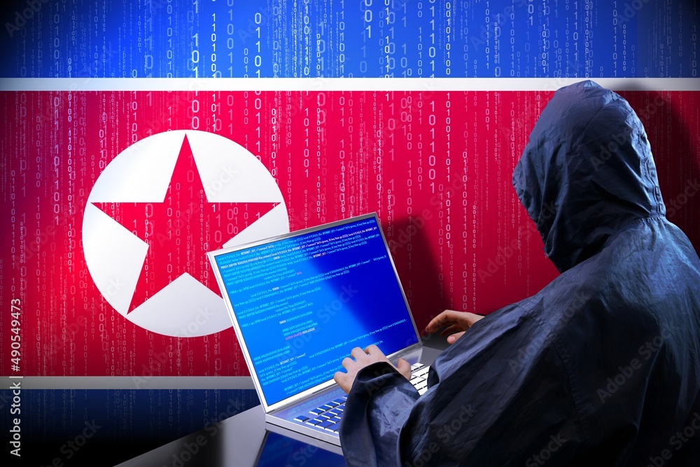 Poster anonymous hooded hacker, flag of north korea, binary code - cyber attack concept