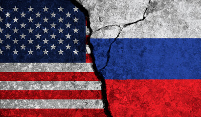 Political relationship between USA and russia. National flags on cracked concrete background