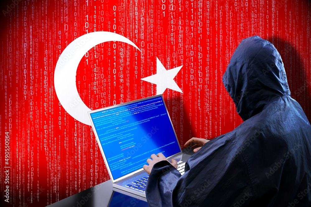 Poster anonymous hooded hacker, flag of turkey, binary code - cyber attack concept