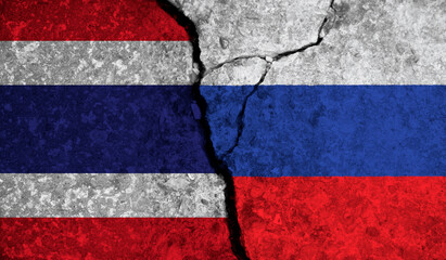 Political relationship between Thailand and russia. National flags on cracked concrete background