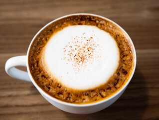 Cappuccino from top view with wooden table.Cup of coffee with copy space.Wood grain.
Milk froth floats on top of a cappuccino or latte.wood grain background and coffee cup.
coffee cream froth.close up