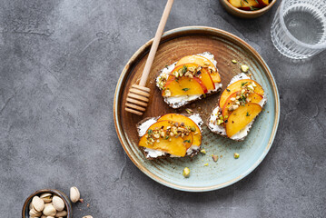 Peach and cream cheese breakfast toast. Peach, ricotta, and hot honey toast. Delicious toast for peak summer