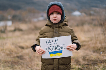 Help Ukraine. War of Russia against Ukraine. Ukrainian Crying boy asks to stop the war in Ukraine....