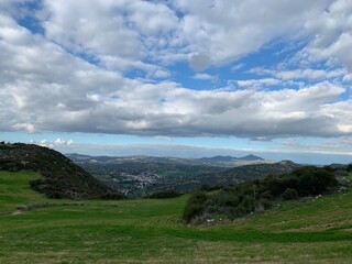 Obraz premium green valley in mountains, blue sky with white clouds