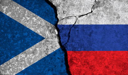 Political relationship between Scotland and russia. National flags on cracked concrete background