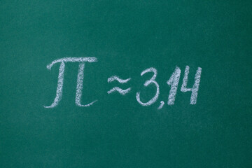 The Greek letter "Pi" on the green blackboard is written in white chalk horizontal photo
