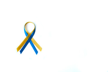 Yellow and blue ribbon in the colors of the flag of Ukraine on a white background with space for text