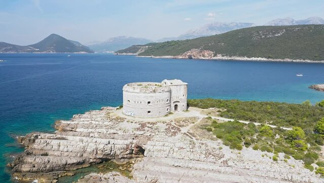 For tarzan in Montenegro. Fortress Arza in the Bay of Kotor on the peninsula of Lustica. Adriatic sea Montenegro.  Fortress for military defense. Aerial photo from the drone.
