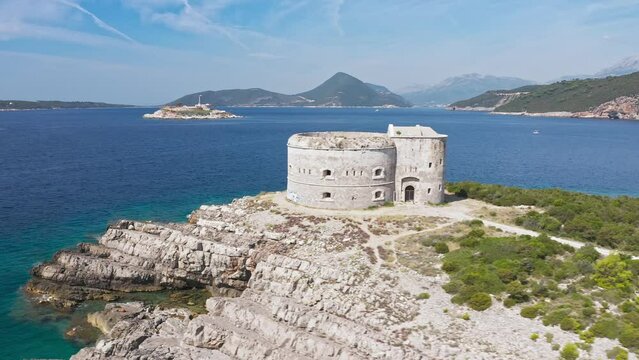 For tarzan in Montenegro. Fortress Arza in the Bay of Kotor on the peninsula of Lustica. Adriatic sea Montenegro.  Fortress for military defense. Aerial photo from the drone.
