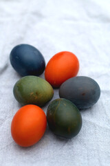 Colorful Easter eggs on neutral fabric. Selective focus.