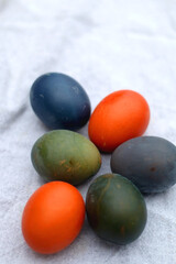 Fototapeta na wymiar Colorful Easter eggs on neutral fabric. Selective focus.