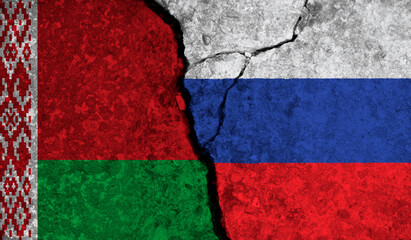 Political relationship between Belarus and russia. National flags on cracked concrete background
