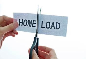 Closeup hand cutting paper for home load concept