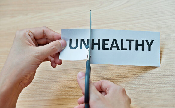 Closeup hand cutting paper for healthy concept